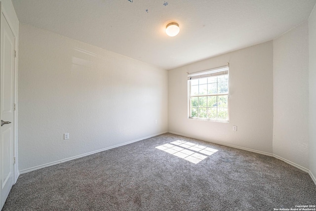 7119 Magnolia Blf, San Antonio, TX 78218 - empty room featuring carpet flooring and baseboards