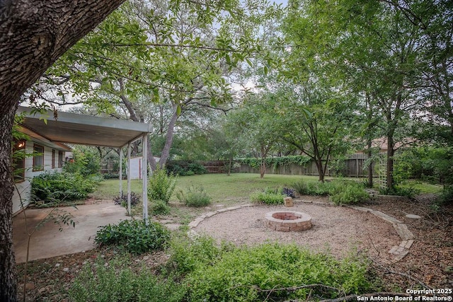 5634 Charlie Chan, San Antonio, TX 78240 - fenced backyard featuring a fire pit and a patio area
