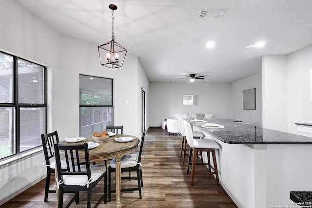 13322 Galicia, Universal City, TX 78148 - dining room with dark wood-style floors, ceiling fan, recessed lighting, and a chandelier