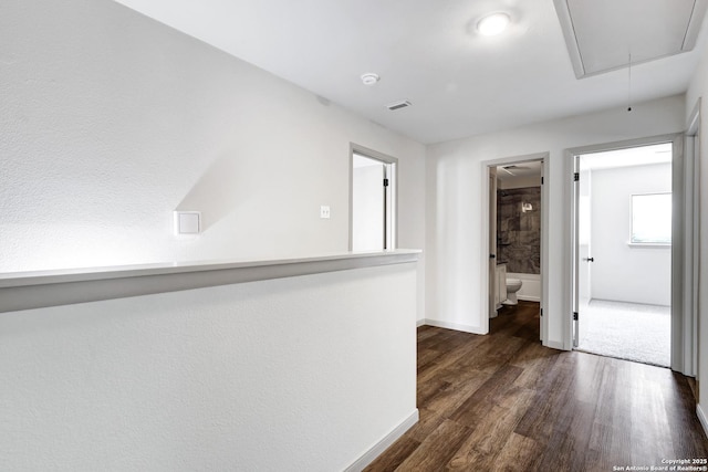 13322 Galicia, Universal City, TX 78148 - corridor featuring attic access and dark wood-style flooring