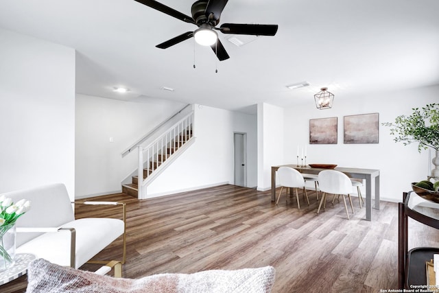 13322 Galicia, Universal City, TX 78148 - living room featuring stairs, wood finished floors, and a ceiling fan