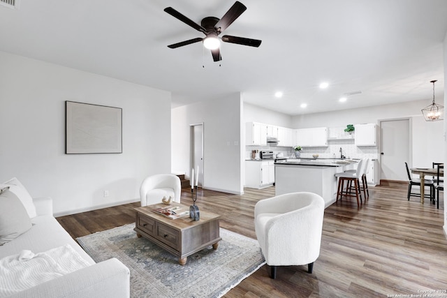 13322 Galicia, Universal City, TX 78148 - living area featuring ceiling fan, recessed lighting, and light wood-type flooring
