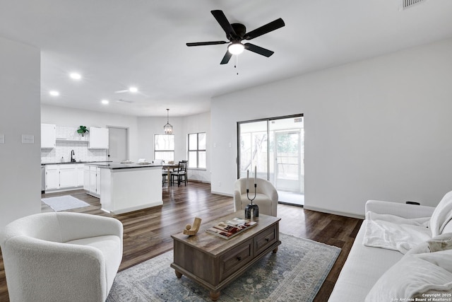 13322 Galicia, Universal City, TX 78148 - living room with recessed lighting, dark wood finished floors, and a ceiling fan