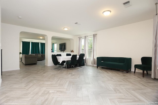 561 Dusty Emerald, Universal City, TX 78148 - living area featuring baseboards and arched walkways