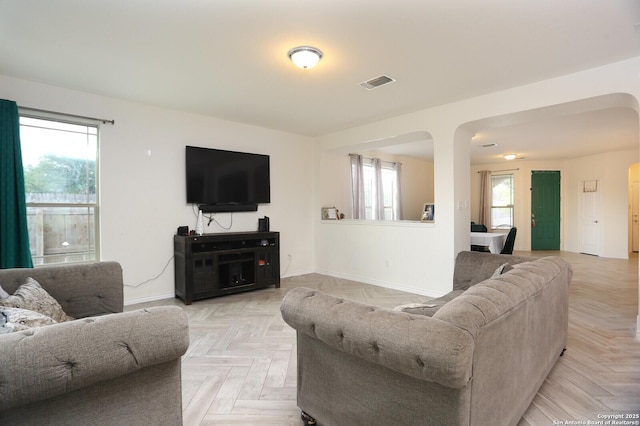 561 Dusty Emerald, Universal City, TX 78148 - living area with baseboards and arched walkways
