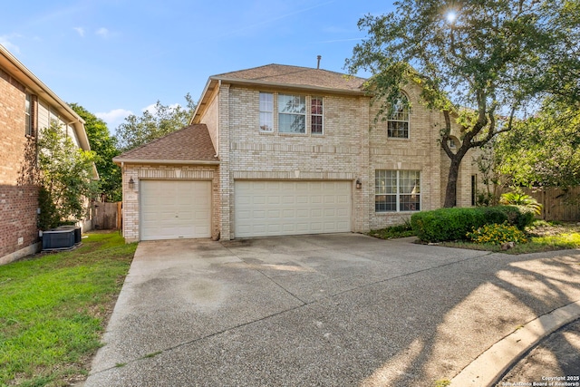 2611 Menard, San Antonio, TX 78251 - traditional home featuring brick siding, concrete driveway, a garage, and a shingled roof