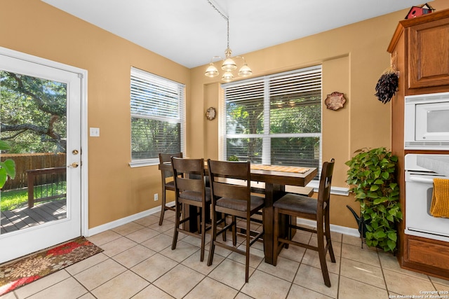 2611 Menard, San Antonio, TX 78251 - dining space with light tile patterned flooring and a chandelier