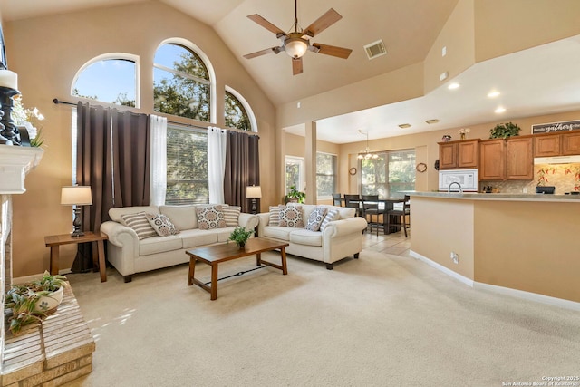 2611 Menard, San Antonio, TX 78251 - living area featuring a ceiling fan, high vaulted ceiling, light carpet, a chandelier, and recessed lighting