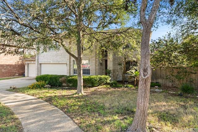 2611 Menard, San Antonio, TX 78251 - obstructed view of property featuring brick siding and driveway