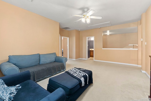 2611 Menard, San Antonio, TX 78251 - living room featuring attic access, a ceiling fan, and carpet