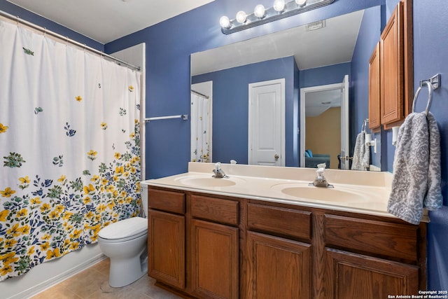 2611 Menard, San Antonio, TX 78251 - bathroom with double vanity, tile patterned flooring, and curtained shower