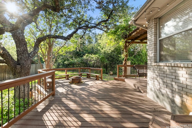 2611 Menard, San Antonio, TX 78251 - wooden terrace featuring an outdoor fire pit
