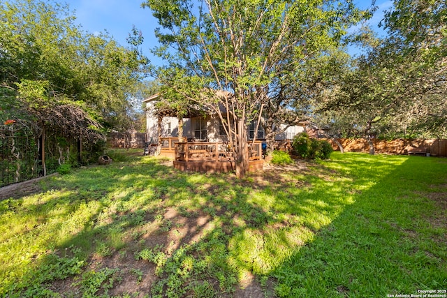 2611 Menard, San Antonio, TX 78251 - fenced backyard with a deck