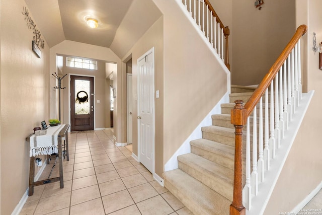2611 Menard, San Antonio, TX 78251 - foyer entrance featuring light tile patterned floors, lofted ceiling, and stairs