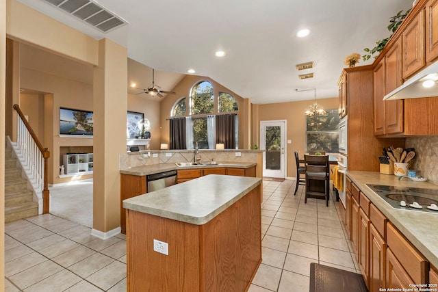 2611 Menard, San Antonio, TX 78251 - kitchen featuring a kitchen island, light tile patterned floors, light countertops, lofted ceiling, and recessed lighting