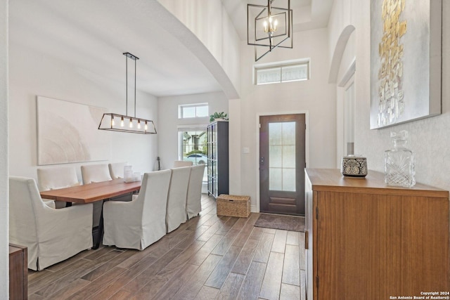 9032 Raven Pointe, San Antonio, TX 78255 - entrance foyer with a chandelier, dark wood-style floors, arched walkways, and a towering ceiling