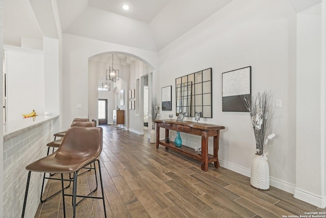 9032 Raven Pointe, San Antonio, TX 78255 - entryway with arched walkways, wood finished floors, and a towering ceiling