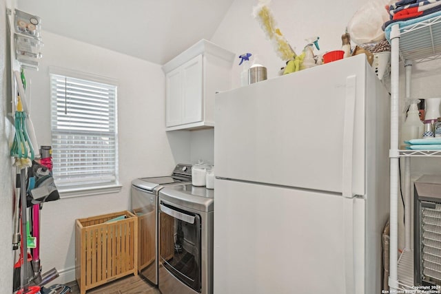 9032 Raven Pointe, San Antonio, TX 78255 - kitchen featuring freestanding refrigerator, washer and clothes dryer, white cabinets, and wood finished floors