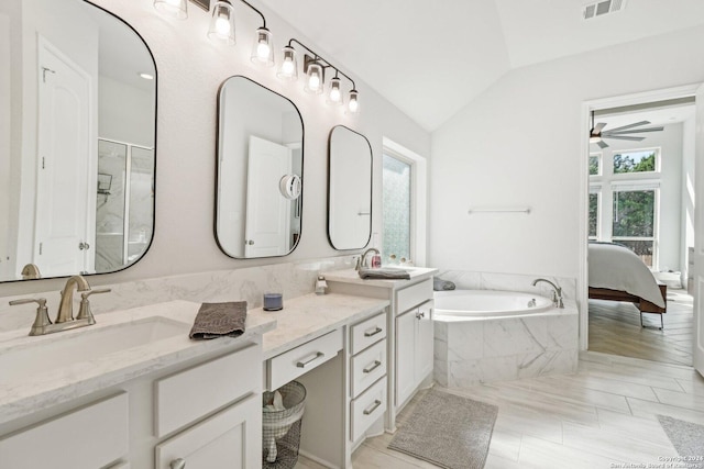 9032 Raven Pointe, San Antonio, TX 78255 - ensuite bathroom featuring ceiling fan, double vanity, a garden tub, lofted ceiling, and an enclosed shower