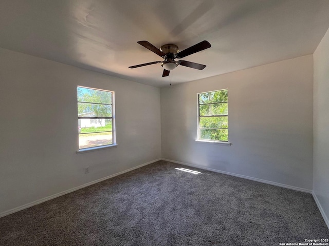 130 N Trevino, Pearsall, TX 78061 - unfurnished room with plenty of natural light, dark carpet, and ceiling fan