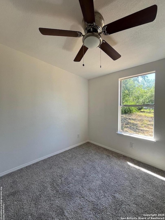 130 N Trevino, Pearsall, TX 78061 - carpeted empty room featuring a textured ceiling and ceiling fan