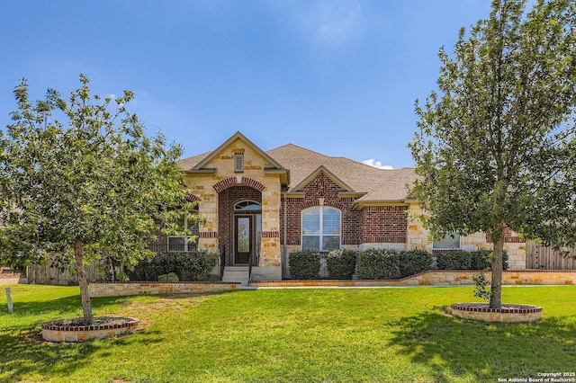 3342 Harvest, Marion, TX 78124 - view of front of house with a front yard, stone siding, brick siding, and a shingled roof