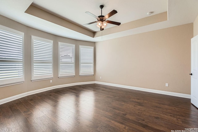 3342 Harvest, Marion, TX 78124 - empty room with a raised ceiling, a ceiling fan, dark wood-style flooring, and a smoke detector