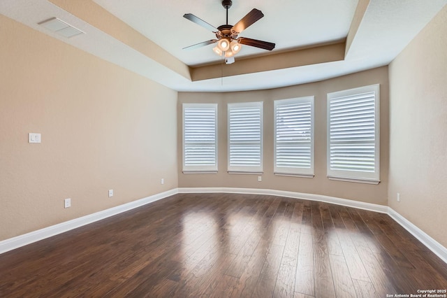 3342 Harvest, Marion, TX 78124 - spare room with a tray ceiling, ceiling fan, and dark wood-style floors