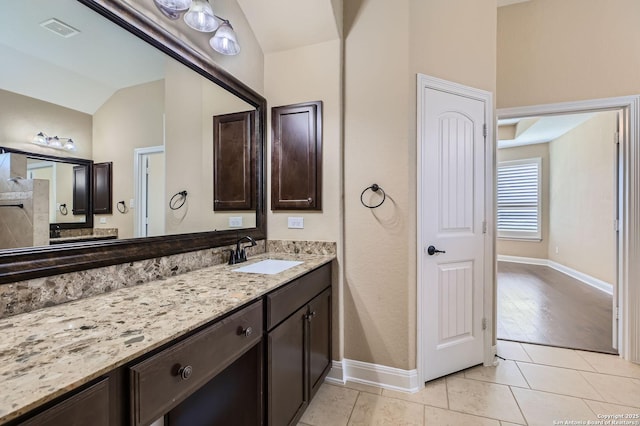 3342 Harvest, Marion, TX 78124 - bathroom featuring lofted ceiling, vanity, and tile patterned flooring