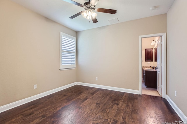 3342 Harvest, Marion, TX 78124 - unfurnished bedroom featuring dark wood-type flooring, a ceiling fan, and ensuite bathroom