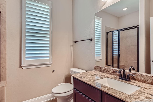 3342 Harvest, Marion, TX 78124 - bathroom with vanity, plenty of natural light, a textured wall, and a shower stall