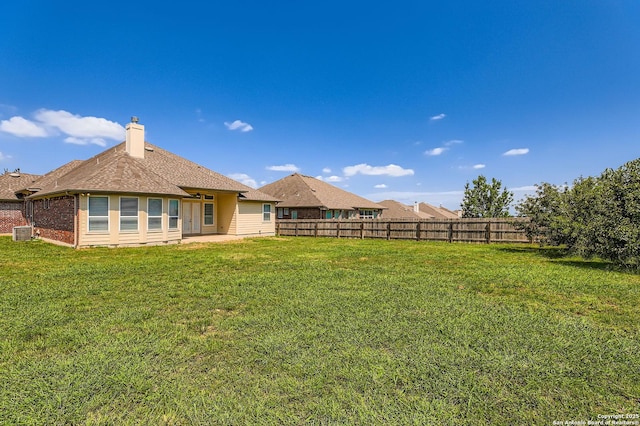 3342 Harvest, Marion, TX 78124 - rear view of house featuring a patio area, brick siding, and a chimney