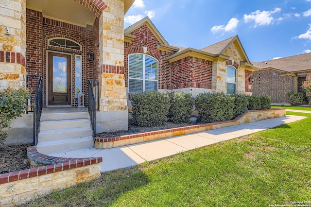 3342 Harvest, Marion, TX 78124 - doorway to property featuring brick siding, stone siding, a yard, and a shingled roof