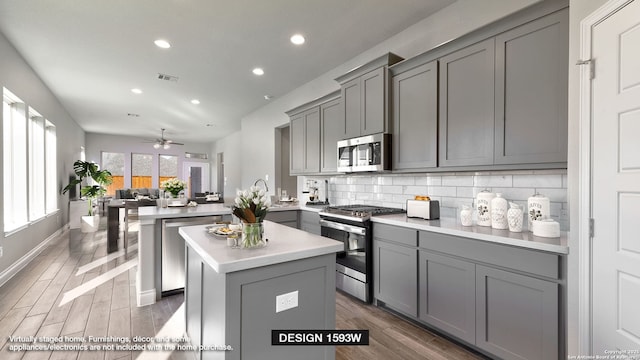 225 Alpine Lks, New Braunfels, TX 78130 - kitchen featuring stainless steel appliances, gray cabinetry, recessed lighting, a peninsula, and light countertops