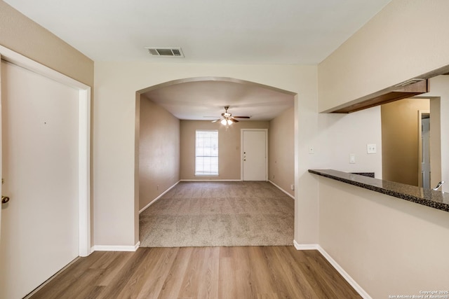 7334 Cherry Brk, San Antonio, TX 78238 - interior space with arched walkways and wood finished floors