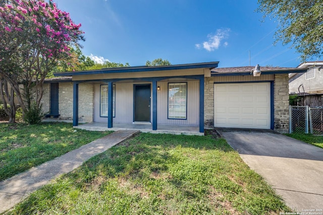 7334 Cherry Brk, San Antonio, TX 78238 - ranch-style house with stone siding, asphalt driveway, a porch, and a garage