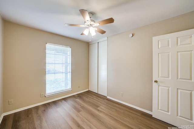 7334 Cherry Brk, San Antonio, TX 78238 - unfurnished bedroom featuring wood finished floors, a closet, and ceiling fan