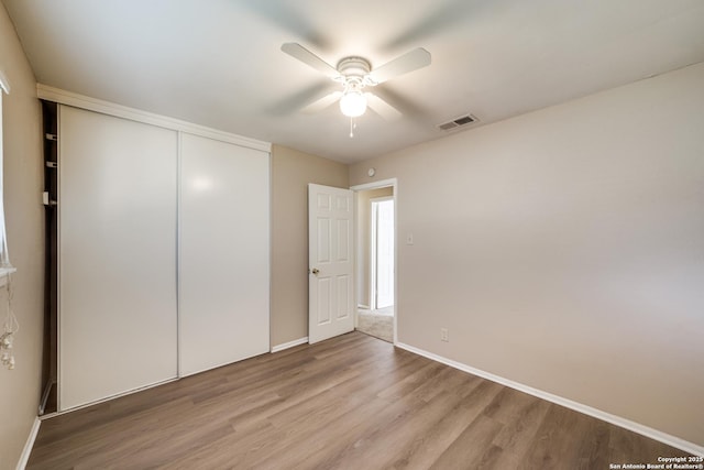 7334 Cherry Brk, San Antonio, TX 78238 - unfurnished bedroom with light wood-type flooring, a closet, and a ceiling fan