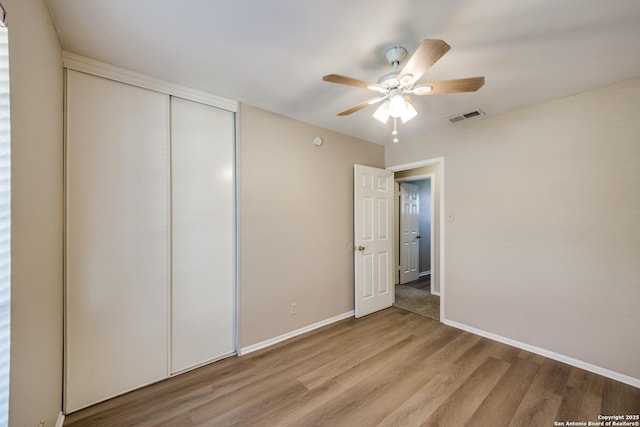 7334 Cherry Brk, San Antonio, TX 78238 - unfurnished bedroom with light wood-style flooring, a closet, and ceiling fan