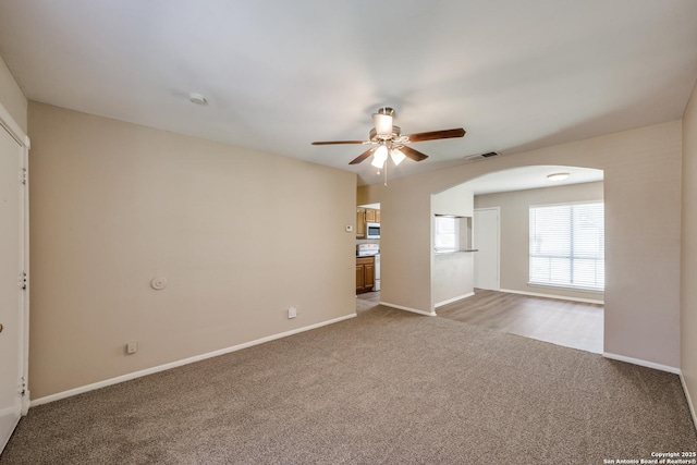 7334 Cherry Brk, San Antonio, TX 78238 - carpeted spare room with a ceiling fan and arched walkways