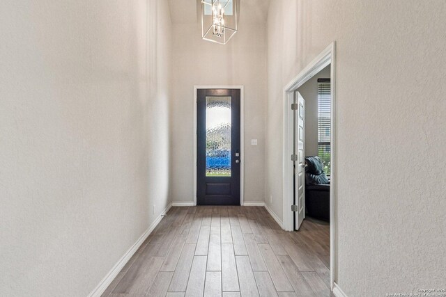 12108 Buckaroo Rnch, San Antonio, TX 78254 - entryway with light wood finished floors and a chandelier