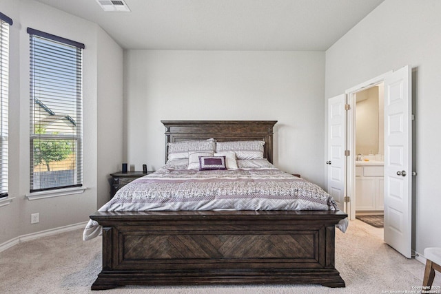 12108 Buckaroo Rnch, San Antonio, TX 78254 - bedroom with light colored carpet and ensuite bath