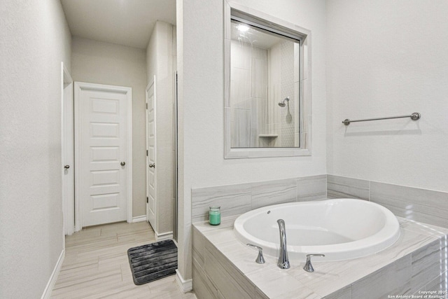 12108 Buckaroo Rnch, San Antonio, TX 78254 - full bathroom with a garden tub and baseboards