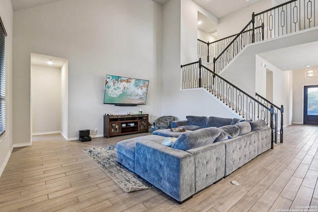 12108 Buckaroo Rnch, San Antonio, TX 78254 - living area with a high ceiling, wood finished floors, and stairs