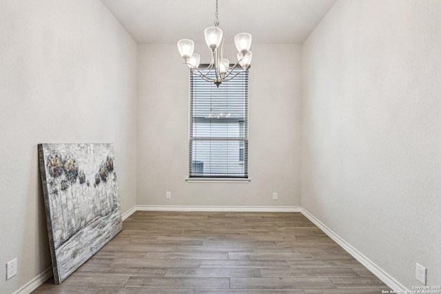 12108 Buckaroo Rnch, San Antonio, TX 78254 - unfurnished room featuring a chandelier and wood finished floors