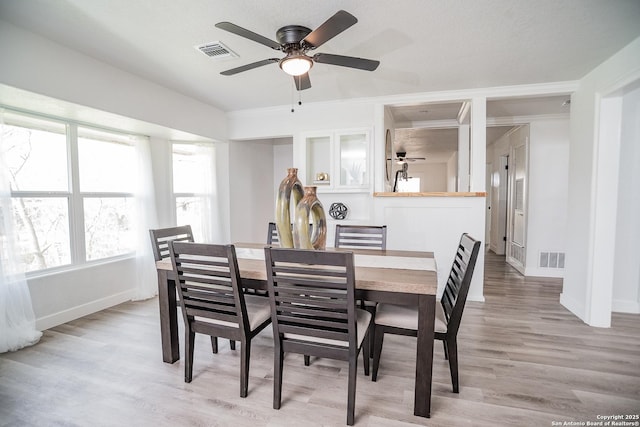 140 Riverview Rd, Mcqueeney, TX 78123 - dining area with a ceiling fan and light wood-type flooring