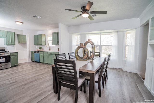 140 Riverview Rd, Mcqueeney, TX 78123 - dining room featuring light wood finished floors and ceiling fan