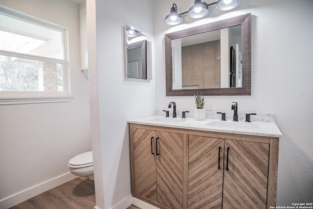 140 Riverview Rd, Mcqueeney, TX 78123 - full bathroom featuring double vanity and wood finished floors