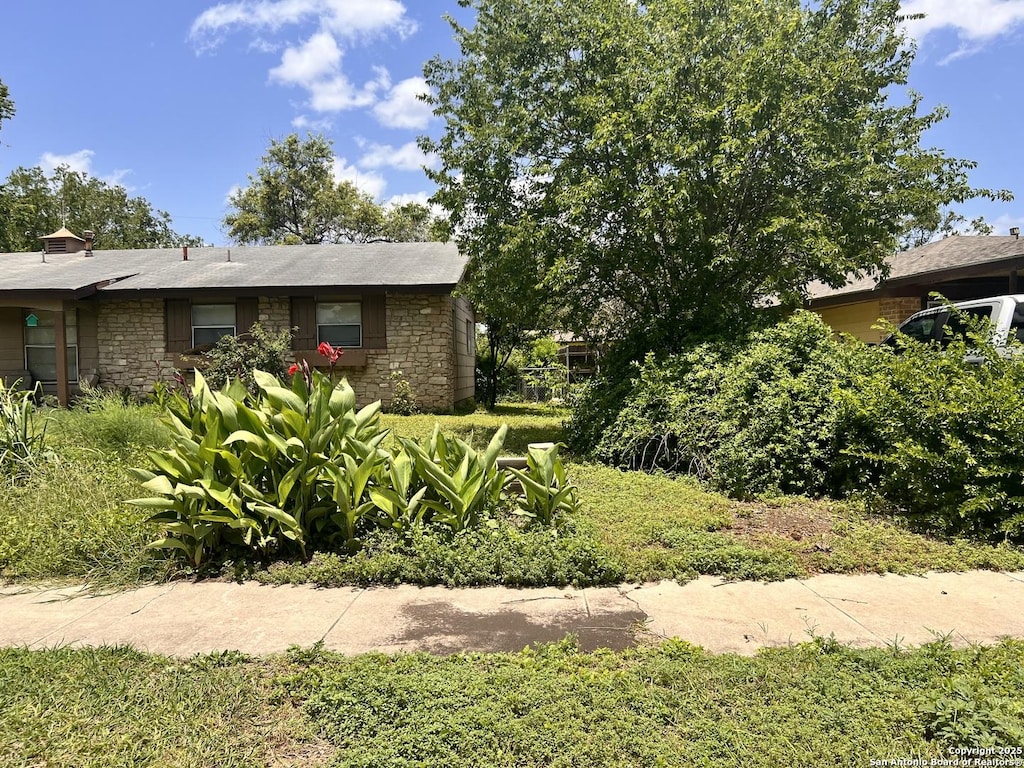 6107 Hazel Vly, San Antonio, TX 78242 - view of side of property with stone siding