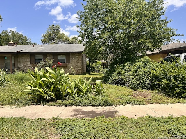 6107 Hazel Vly, San Antonio, TX 78242 - view of side of property with stone siding